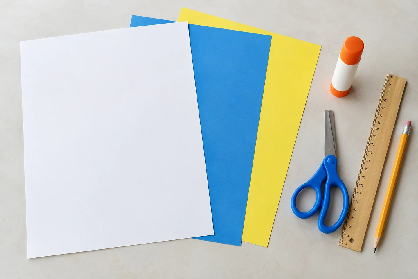 Base paper, contrasting paper, glue, scissors, ruler and pencil for weaving.