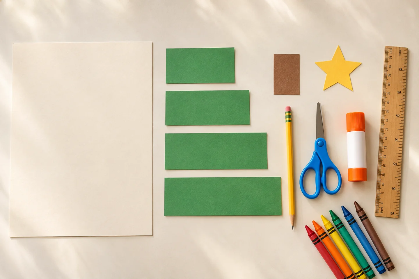 Organized overhead layout of these actual materials: 1 sheet of cardstock, approximately 8½ × 11 inches; Green paper: four rectangles, 2 × 3, 2 × 4, 2 × 5, and 2 × 6 inches; 1 small brown paper rectangle and 1 paper star; Ruler, pencil, child-friendly scissors, and glue stick; Crayons or colored pencils.