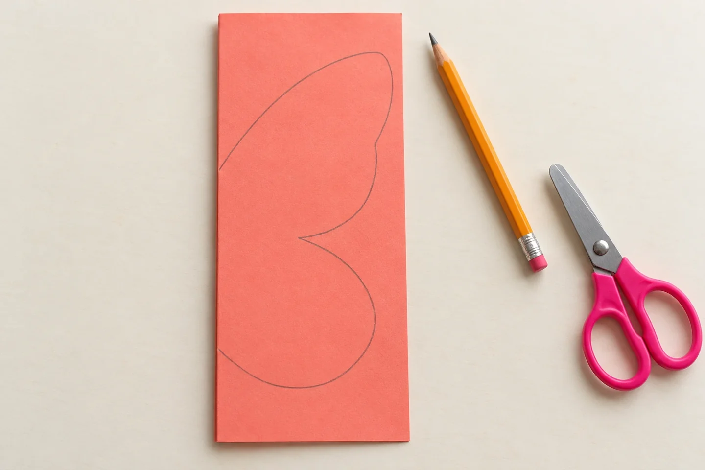 Coral 9 by 12 inch sheet folded to 4.5 by 12 inches, closed fold vertical on left
